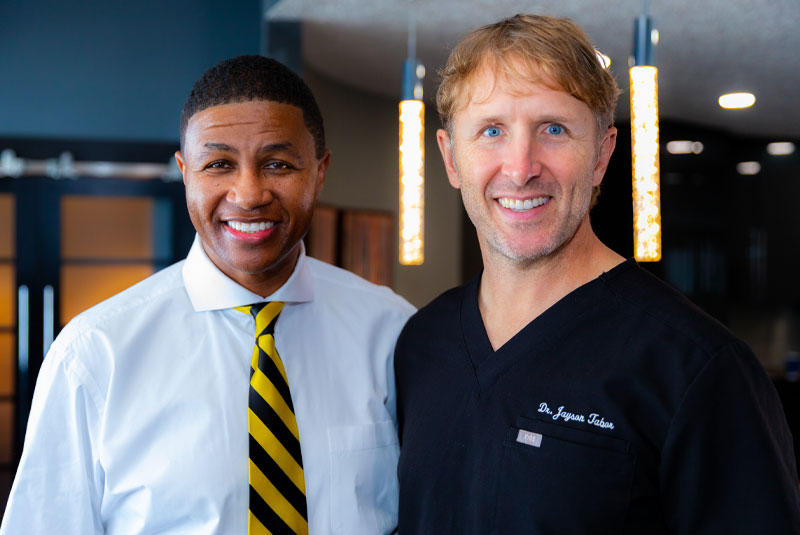 Derrick, A Full Mouth Cosmetic Restoration Patient, Smiling With Dr. Tabor