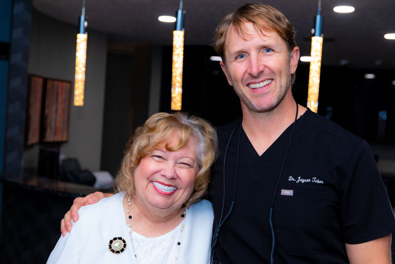 Patty, An All On 4 Dental Implants Patient, Smiling With Dr. Tabor