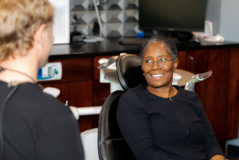 Sandra, An All On 4 Dental Implant Patient, Smiling During Her Consultation