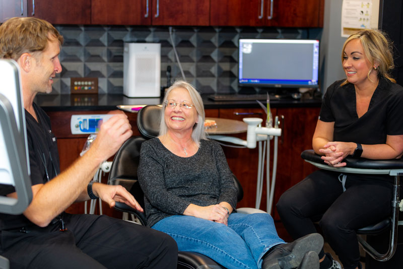 Stephanie, A Dental Implant And Full Mouth Restoration Patient, Smiling During Her Consultation