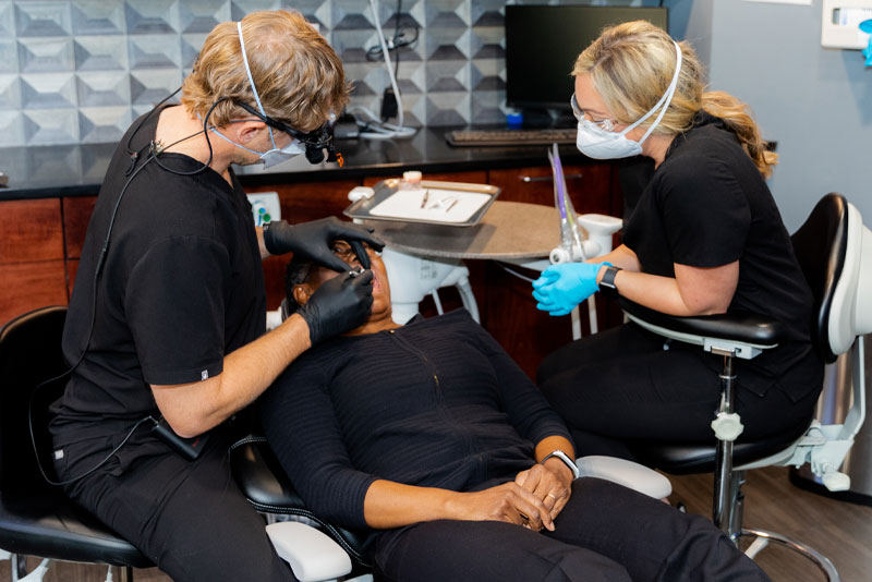 dr tabor performing dental procedure