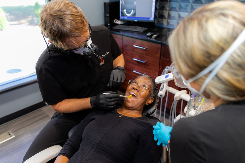 dr tabor performing dental procedure