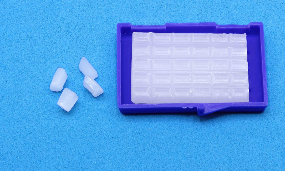 Orthodontic wax container with small pieces of dental wax used to reduce irritation from braces and orthodontic appliances.