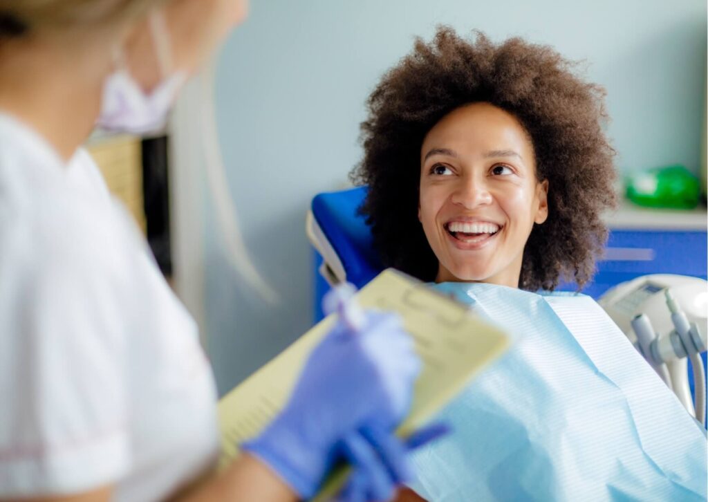 Patient discussing treatment options and cost of dental implants during a personalized dental consultation appointment